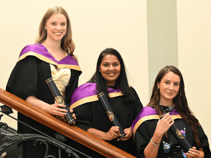 3 doctors on a stairs at the RCPI Membership Conferring Ceremony